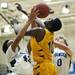 Pioneer senior Tevis Robinson and Ypsilanti junior Jaylen Johnson try to grab a rebound in the game on Monday, March 4. Daniel Brenner I AnnArbor.com